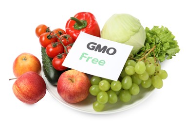 Photo of Fresh fruits, vegetables and card with text GMO Free on white background