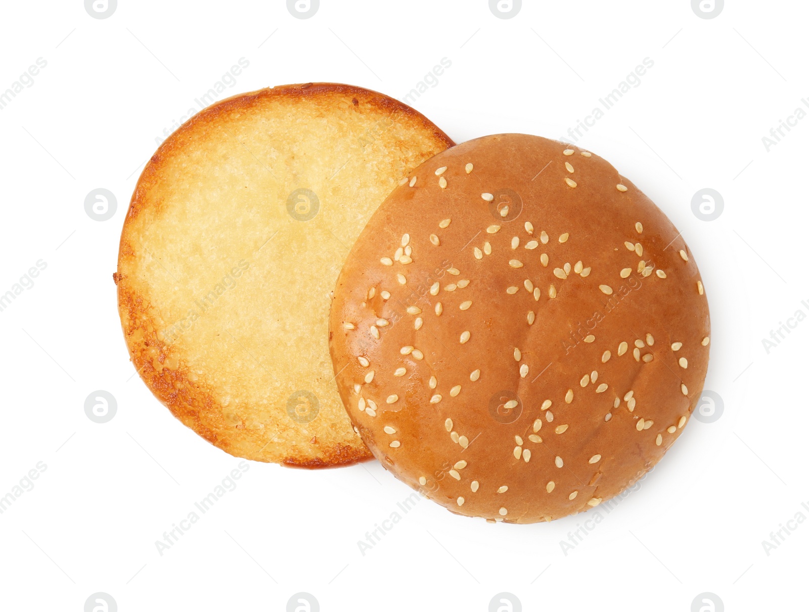 Photo of Halves of grilled burger bun isolated on white, top view