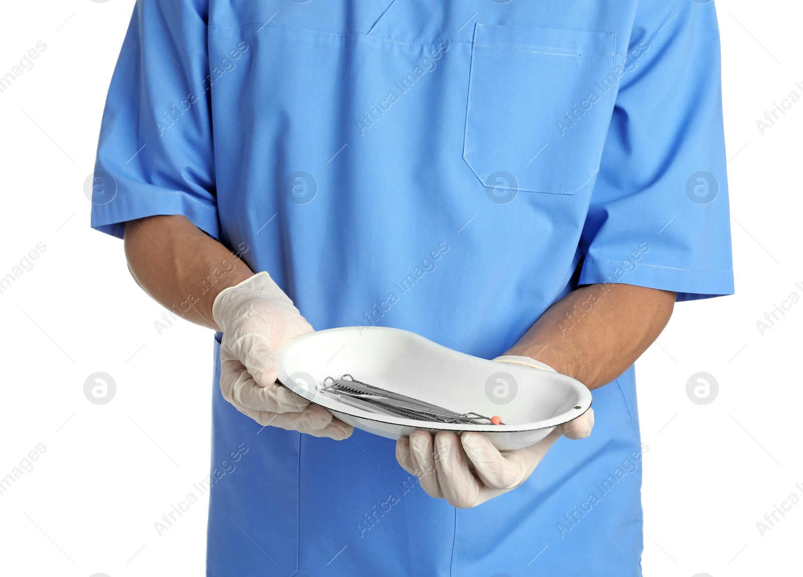 Photo of Male doctor holding dish with medical tools on white background, closeup. Medical objects