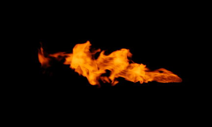 Photo of Beautiful bright fire flames on black background