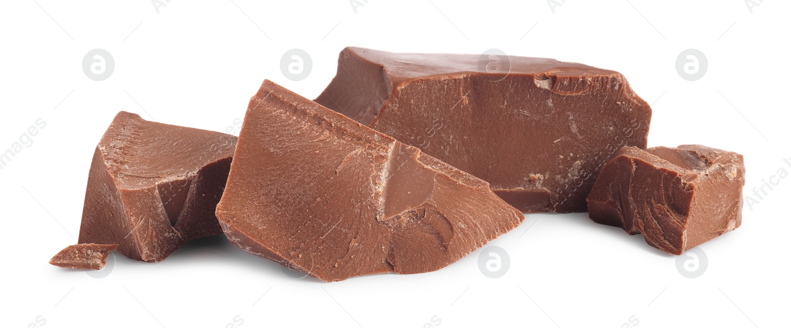 Photo of Pieces of tasty milk chocolate isolated on white
