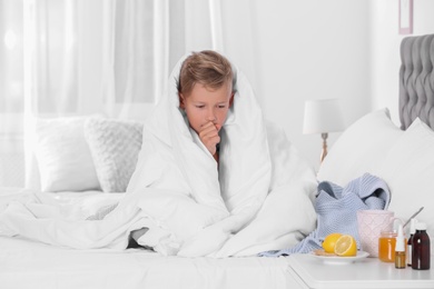 Ill boy suffering from cough at home