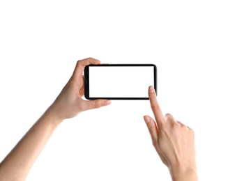 Woman holding smartphone with blank screen on white background, closeup of hands. Space for text