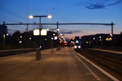Blurred view of railway platform at night