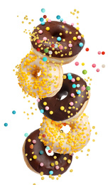 Image of Set of falling delicious donuts on white background