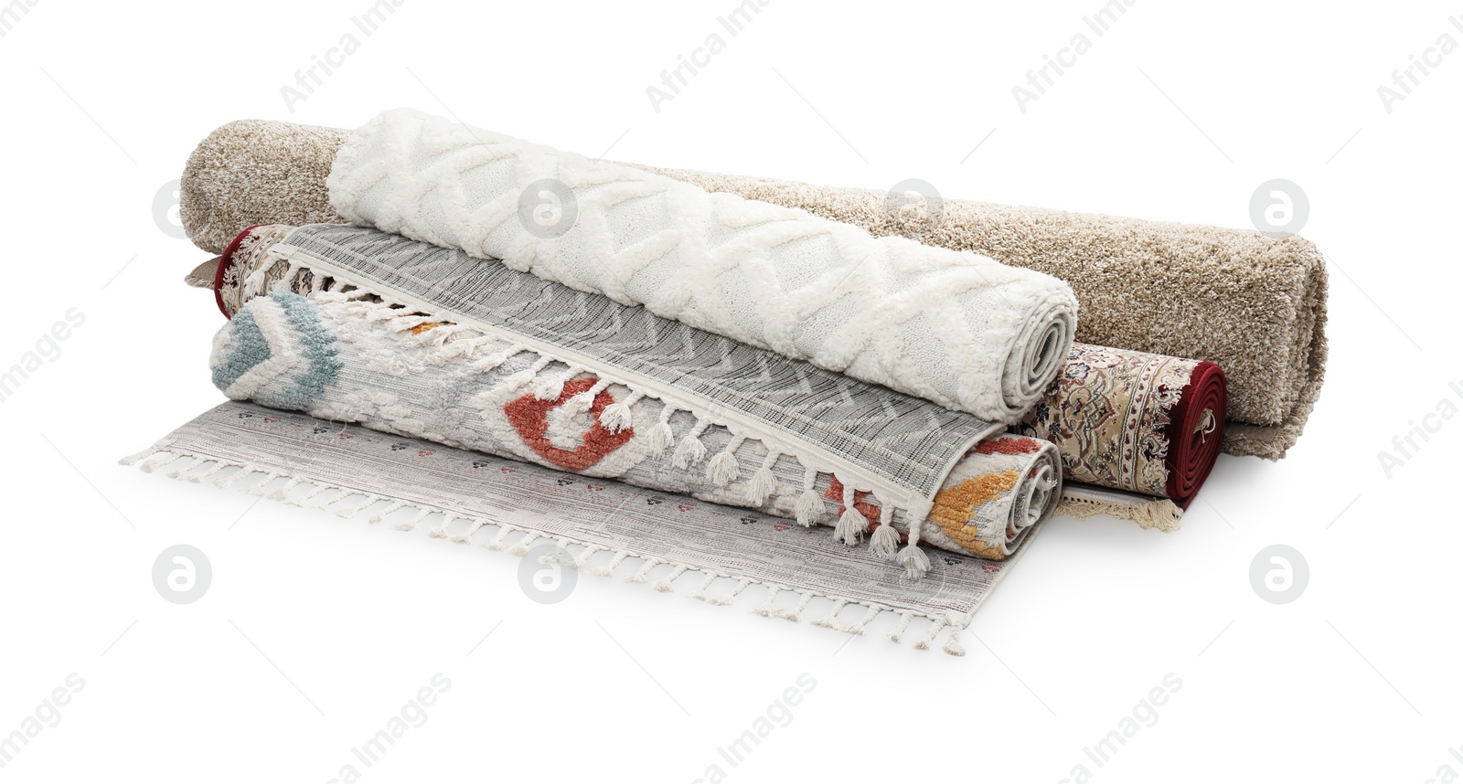 Photo of Rolled carpets on white background. Interior element