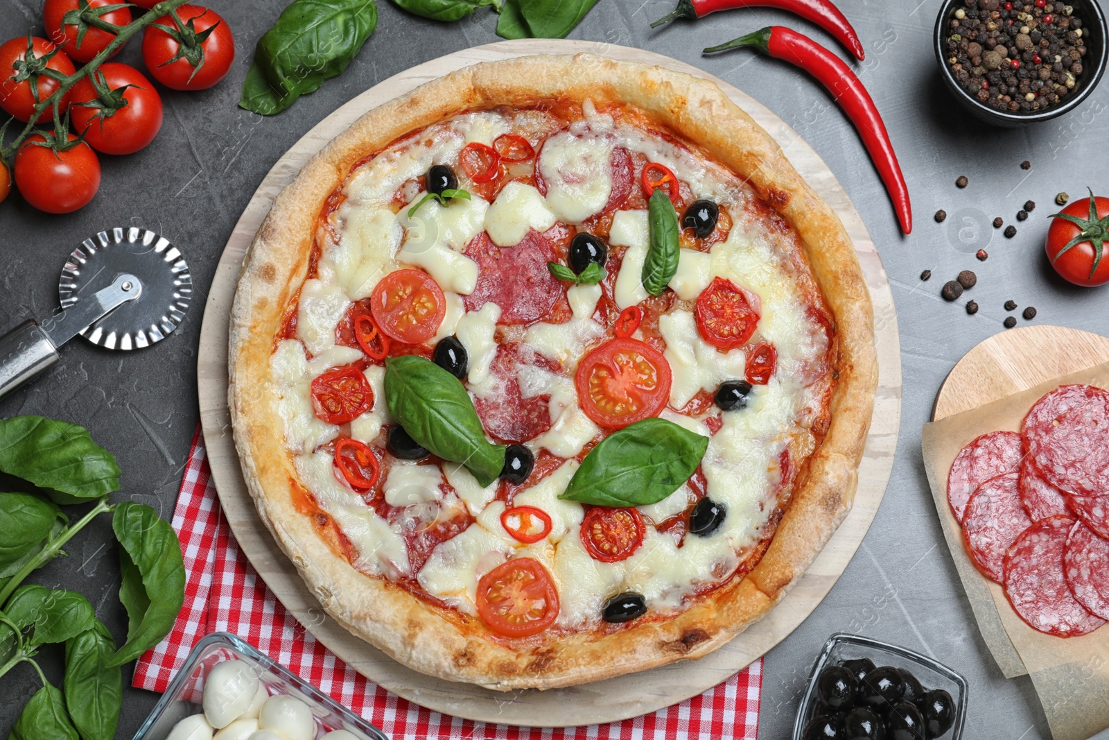 Photo of Delicious pizza Diablo on grey table, flat lay