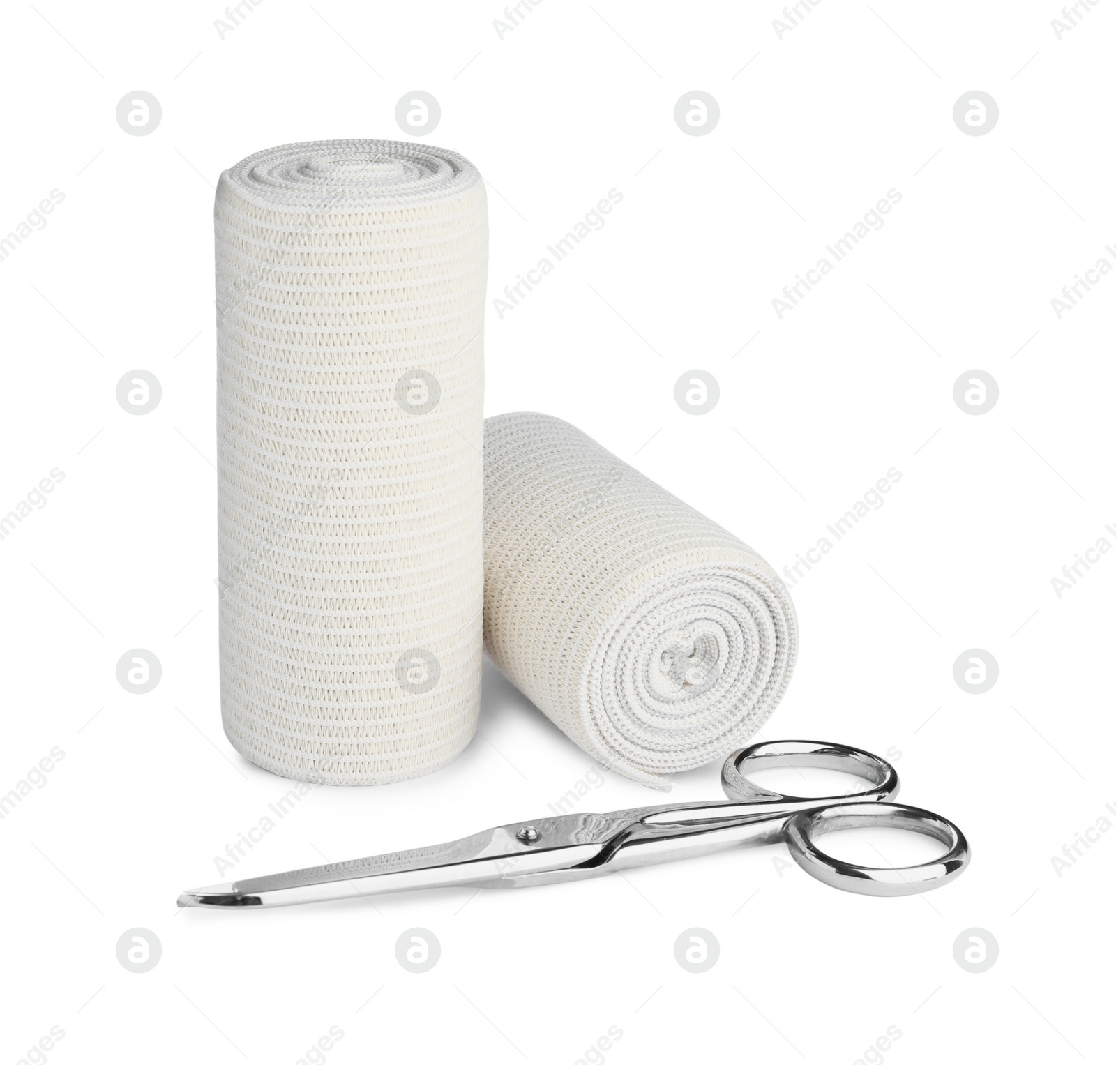 Photo of Medical bandage rolls and scissors on white background