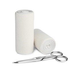 Photo of Medical bandage rolls and scissors on white background