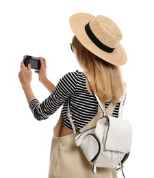 Woman with backpack taking picture on white background. Summer travel