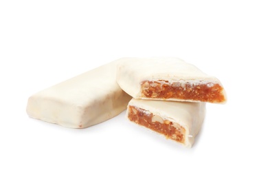 Photo of Tasty glazed protein bars on white background