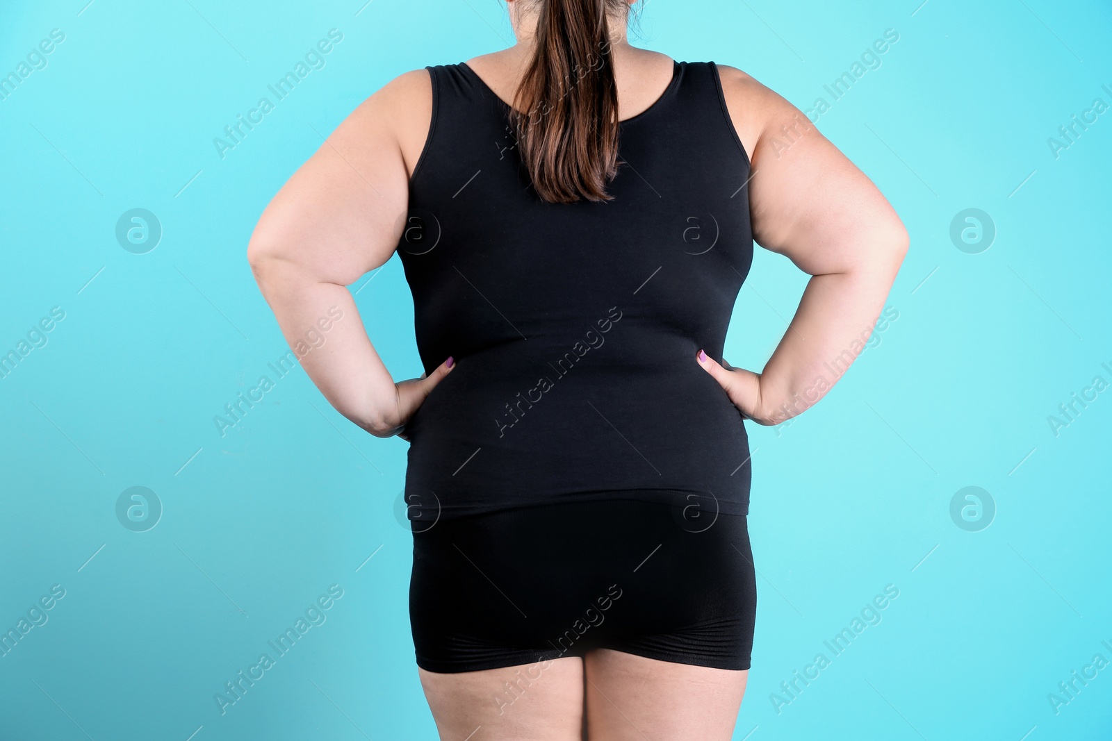 Photo of Overweight woman before weight loss on color background