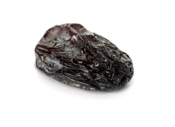 Tasty raisin on white background. Healthy dried fruit