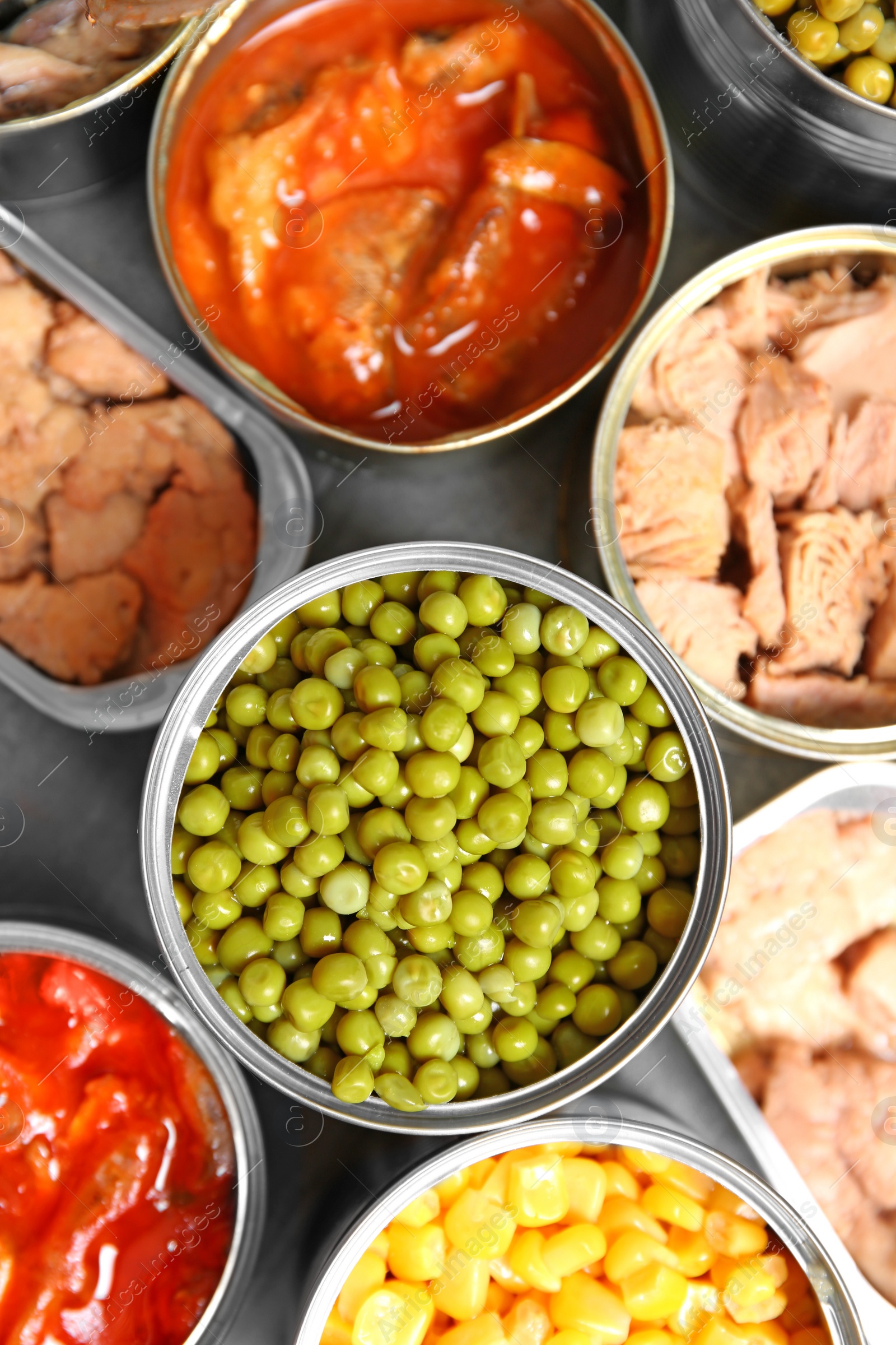 Photo of Open tin cans of conserved products, top view