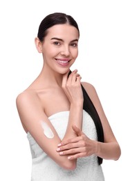 Photo of Beautiful woman with smear of body cream on her arm against white background