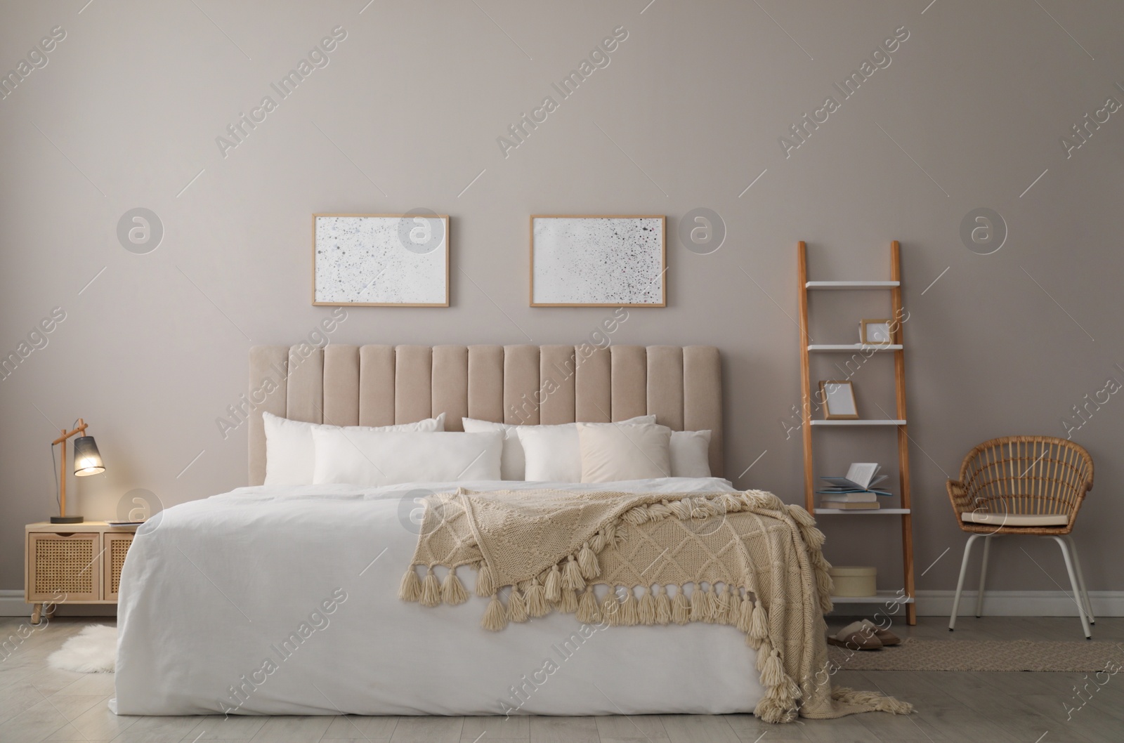 Photo of Cozy bed with soft linens in light room