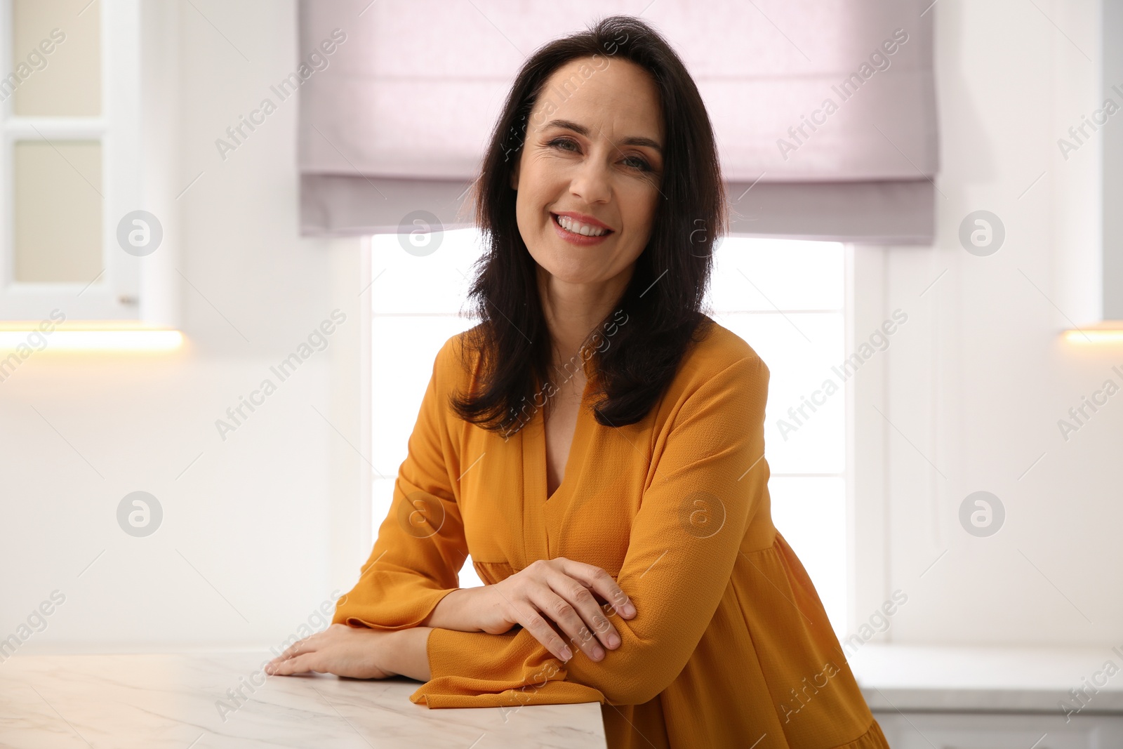 Photo of Portrait of beautiful mature woman at home