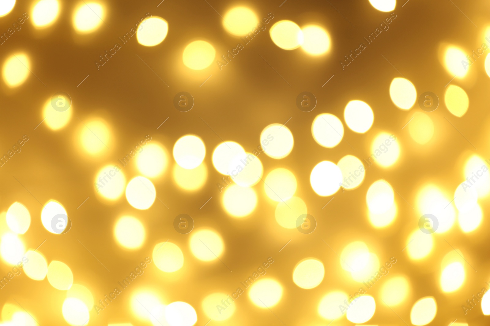 Photo of Beautiful golden lights as background. Bokeh effect