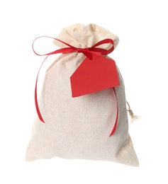 Photo of Small bag with red ribbon and blank red tag isolated on white. Christmas advent calendar
