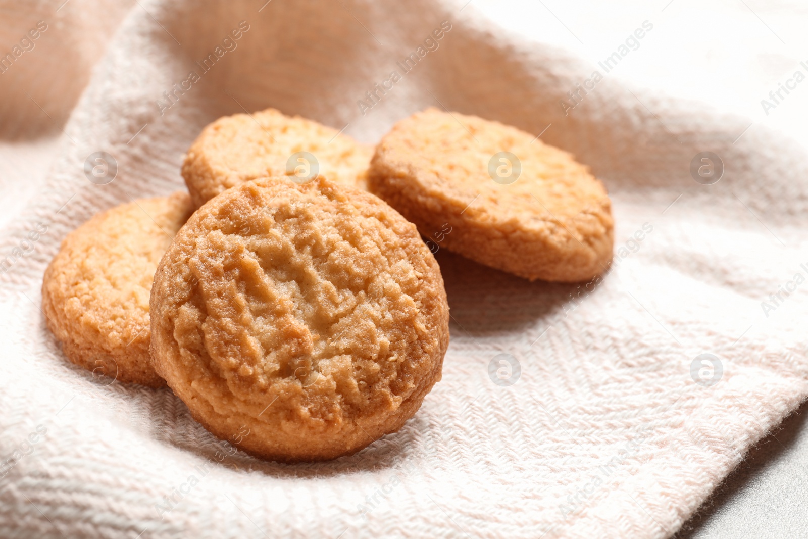 Photo of Tasty Danish butter cookies on color napkin, closeup