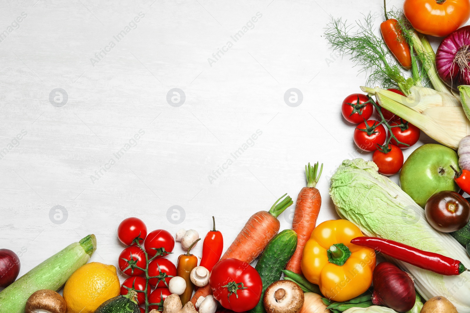 Photo of Frame made of fresh vegetables on light table, flat lay. Space for text
