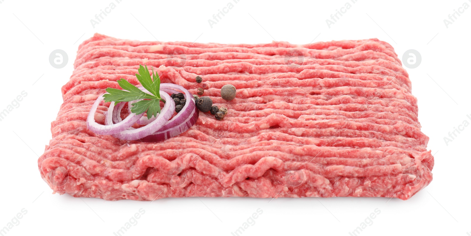 Photo of Raw ground meat, onion, peppercorns and parsley isolated on white