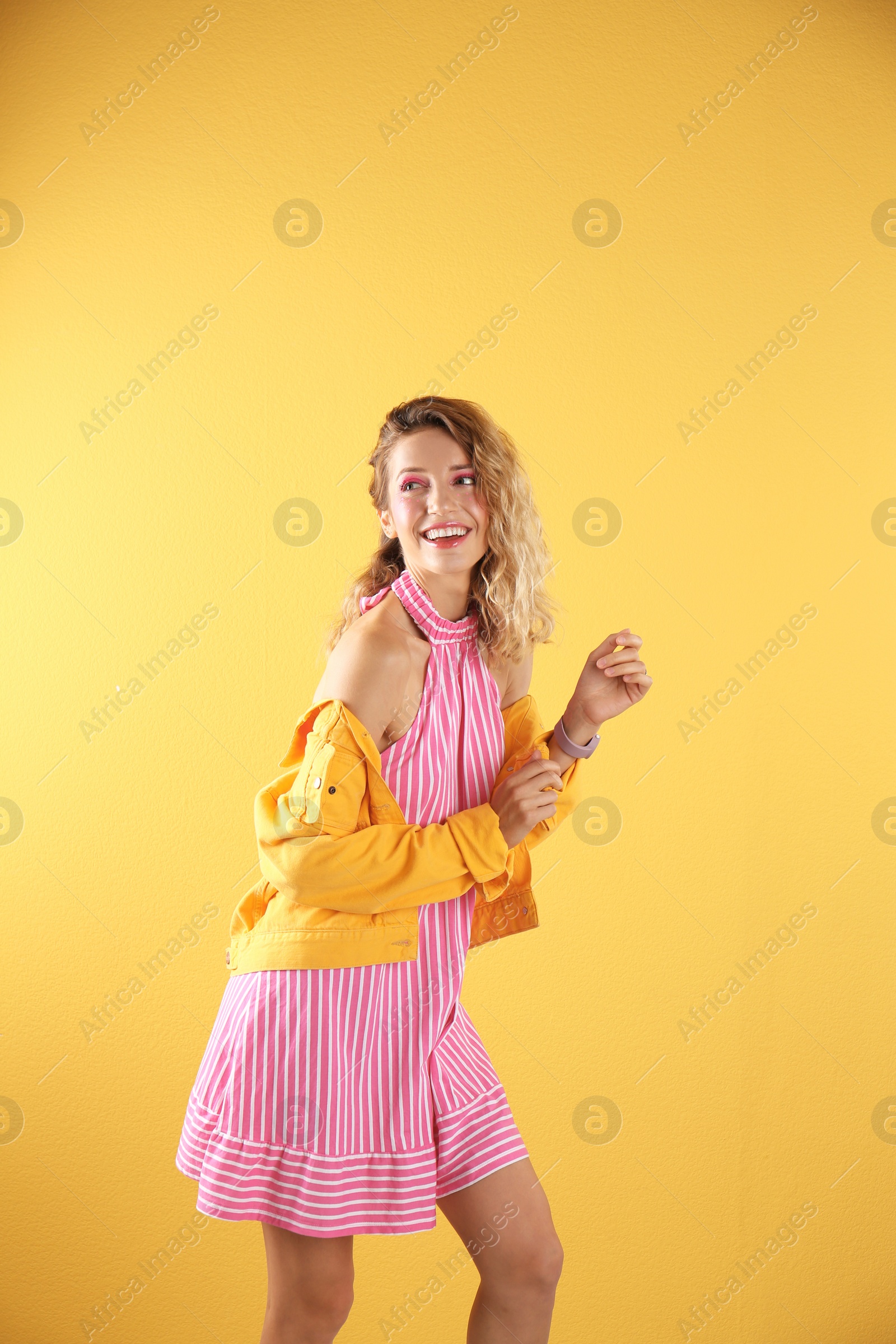 Photo of Beautiful young woman posing on color background. Summer fashion