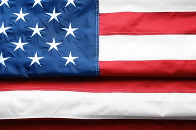 Folded American flag as background, top view