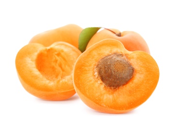 Photo of Delicious ripe sweet apricots isolated on white