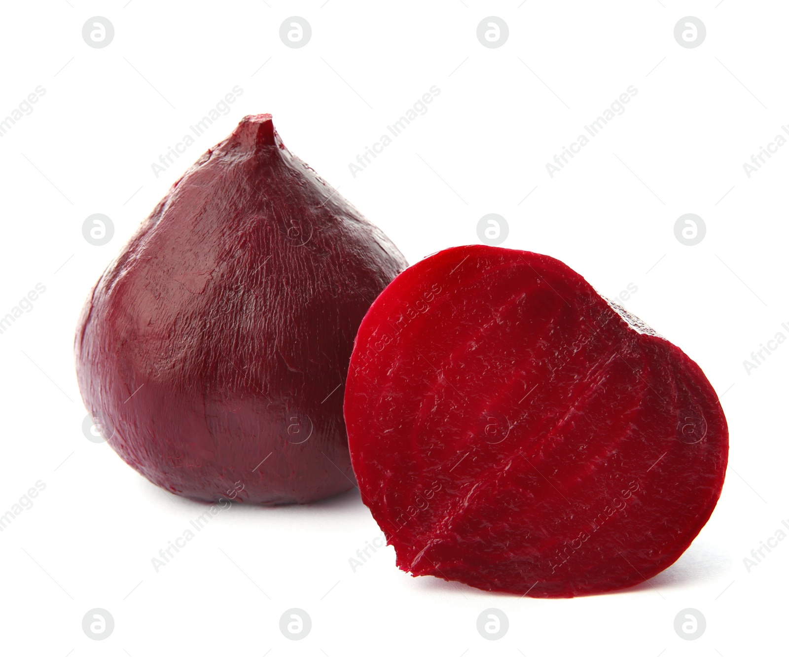 Photo of Whole and cut boiled red beets on white background