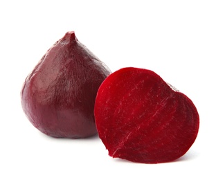 Photo of Whole and cut boiled red beets on white background