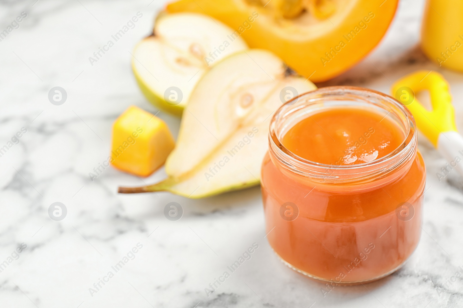 Photo of Healthy baby food and fresh ingredients on white marble table. Space for text