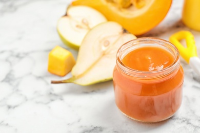 Photo of Healthy baby food and fresh ingredients on white marble table. Space for text