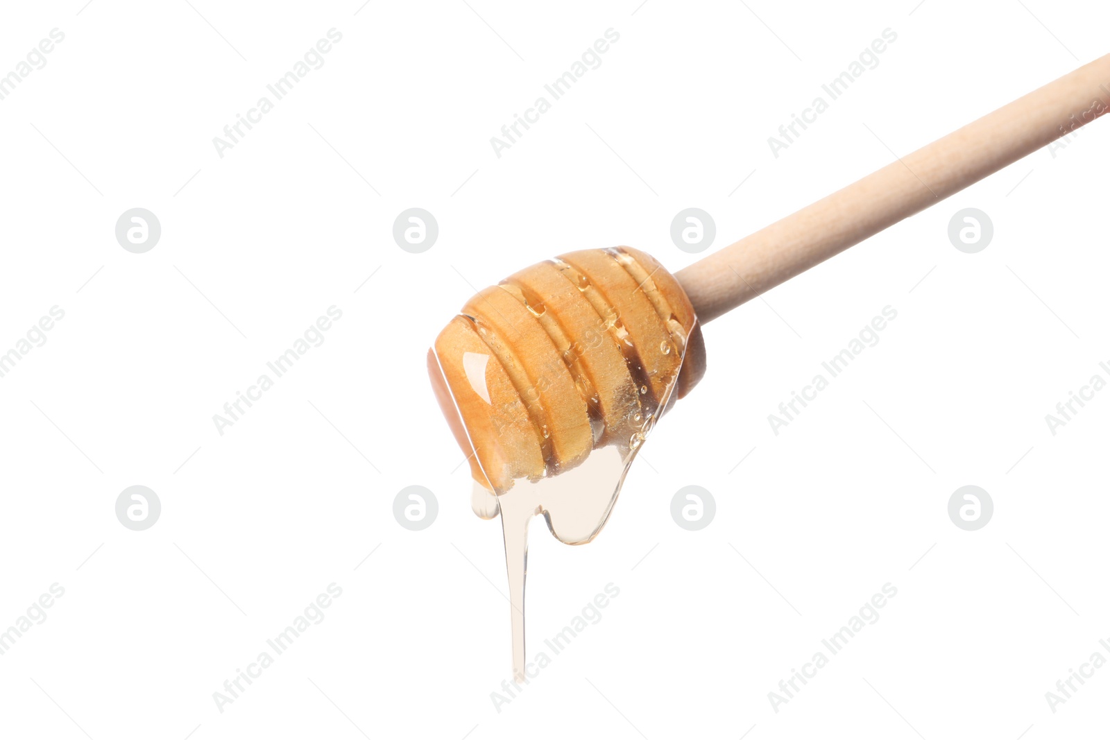 Photo of Natural honey dripping from dipper on white background