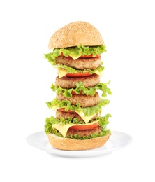 Plate with yummy huge burger on white background