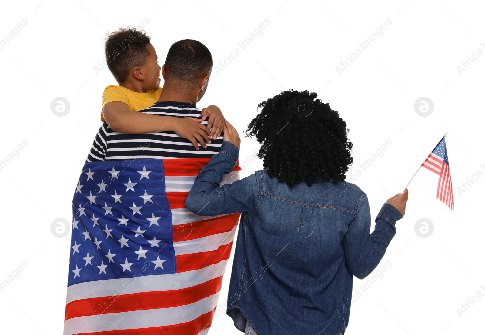 Photo of 4th of July - Independence Day of USA. Family with American flags on white background, back view