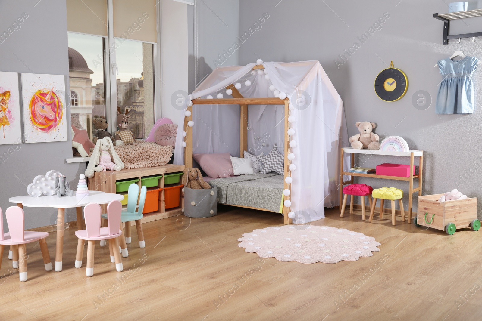 Photo of Stylish child room interior with comfortable house bed