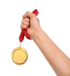 Photo of Woman holding gold medal on white background, closeup