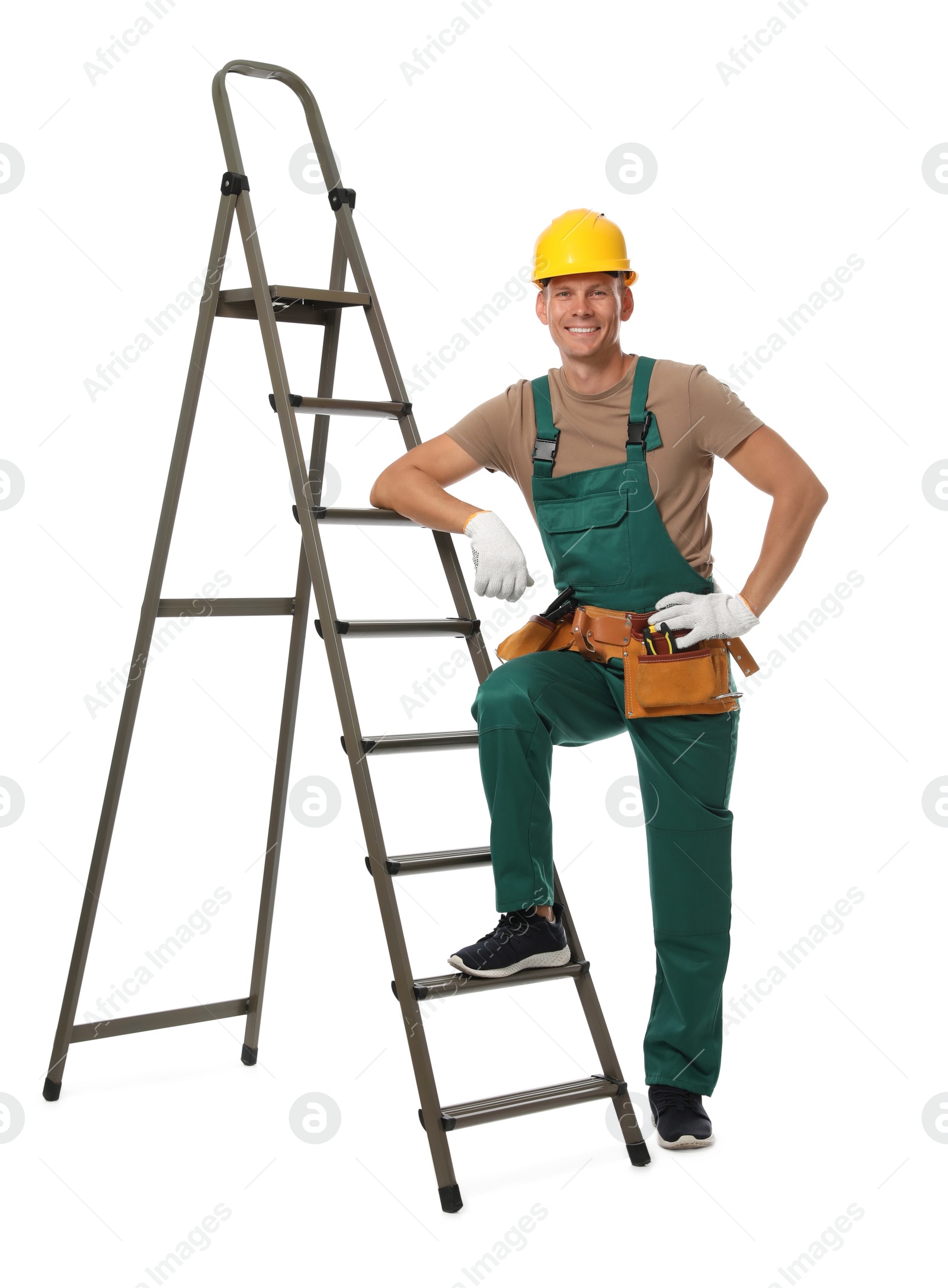 Photo of Professional constructor near ladder on white background