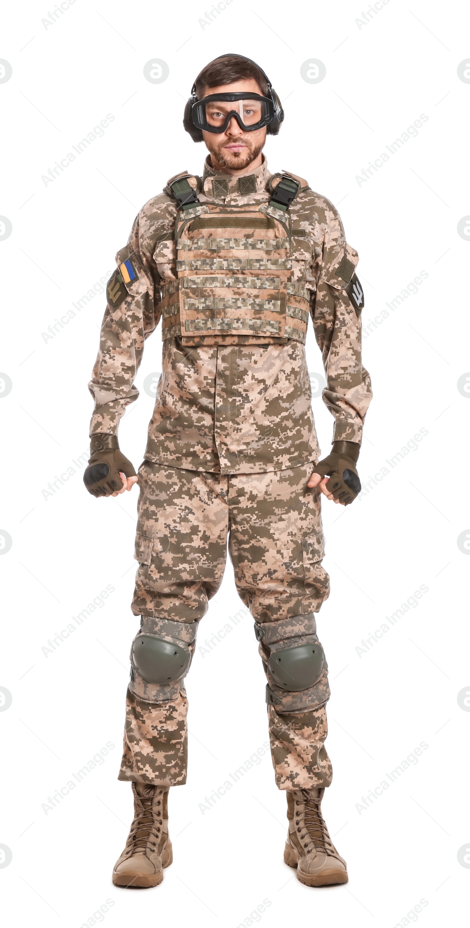 Photo of Soldier in Ukrainian military uniform, tactical goggles and headphones on white background