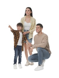 Little boy with his parents together on white background