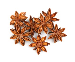 Dry anise stars with seeds on white background, top view