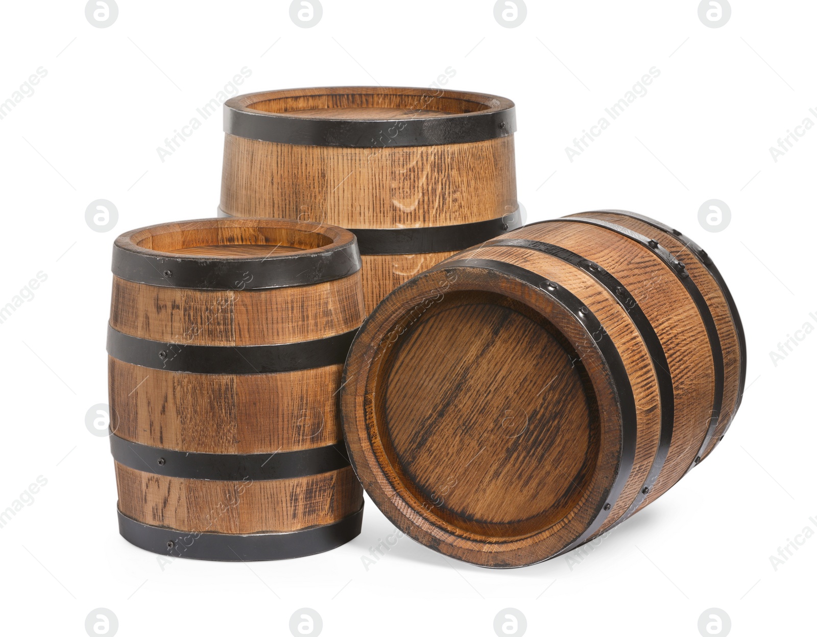 Photo of Three traditional wooden barrels on white background