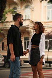 Photo of Beautiful young couple in love on city street