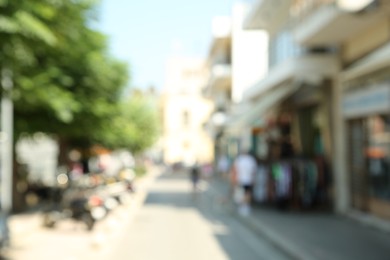 Blurred view of city street on sunny day