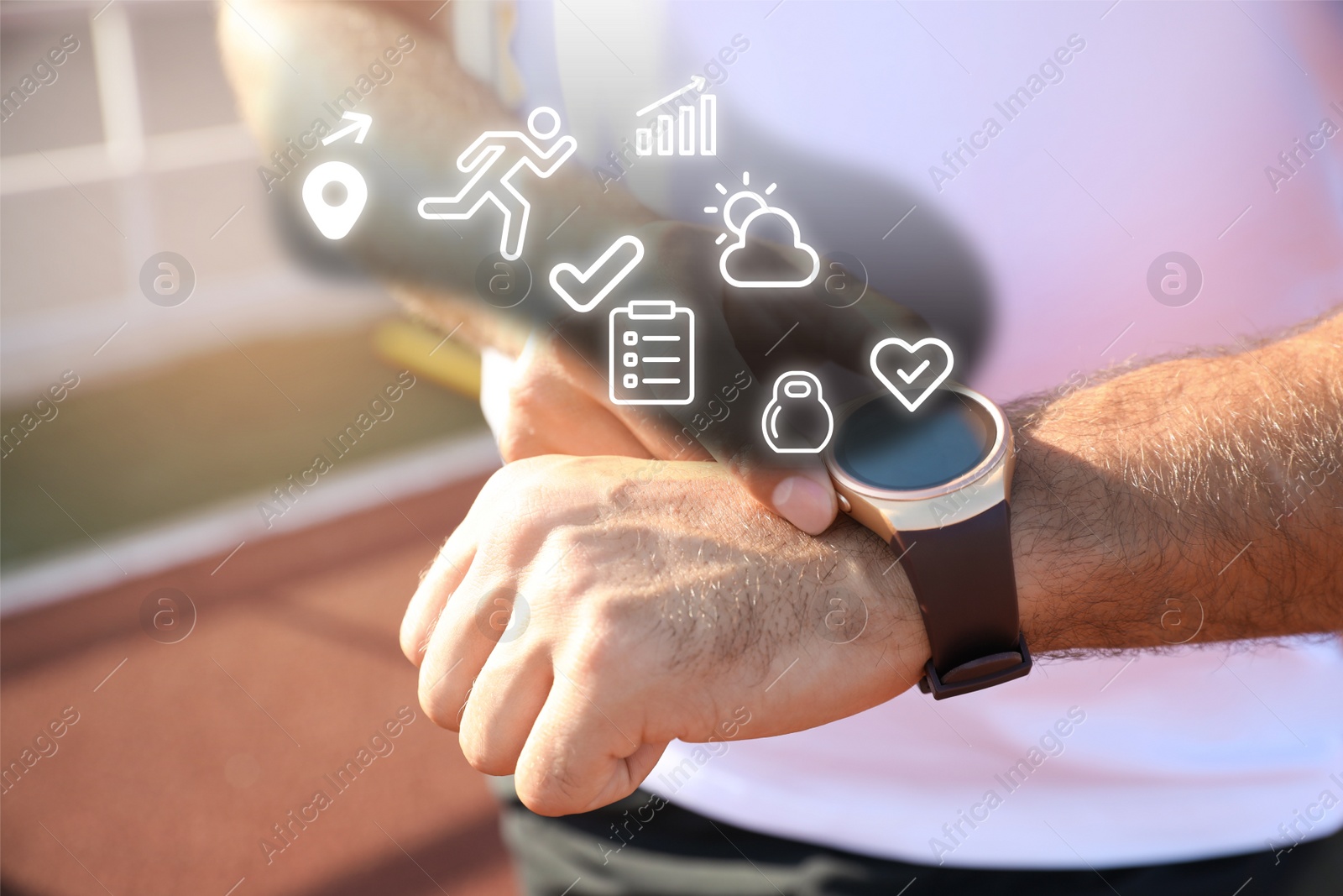 Image of Man checking fitness tracker after training at stadium, closeup