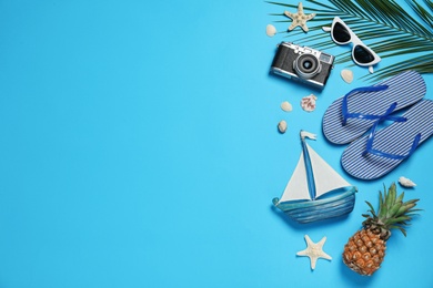 Photo of Flat lay composition with beach accessories on color background, space for text