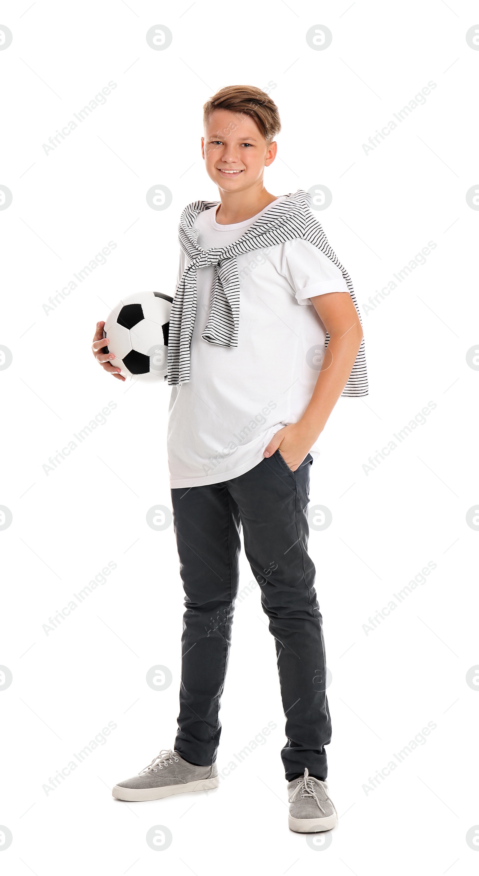 Photo of Teenage boy with soccer ball on white background