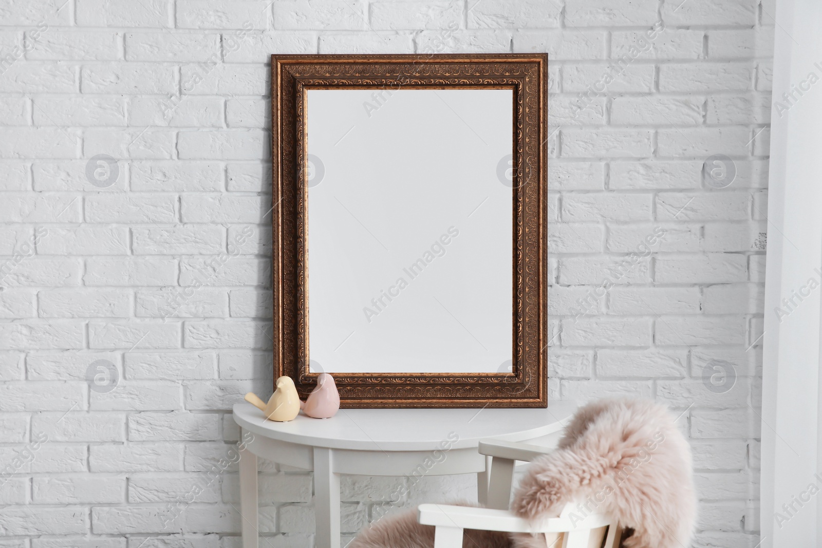 Photo of Beautiful mirror on table in modern makeup room