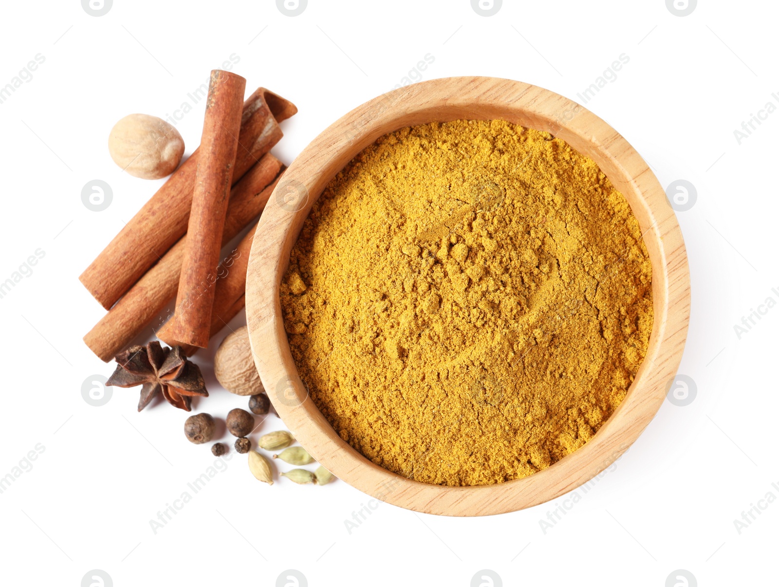 Photo of Dry curry powder in bowl and other spices isolated on white, top view